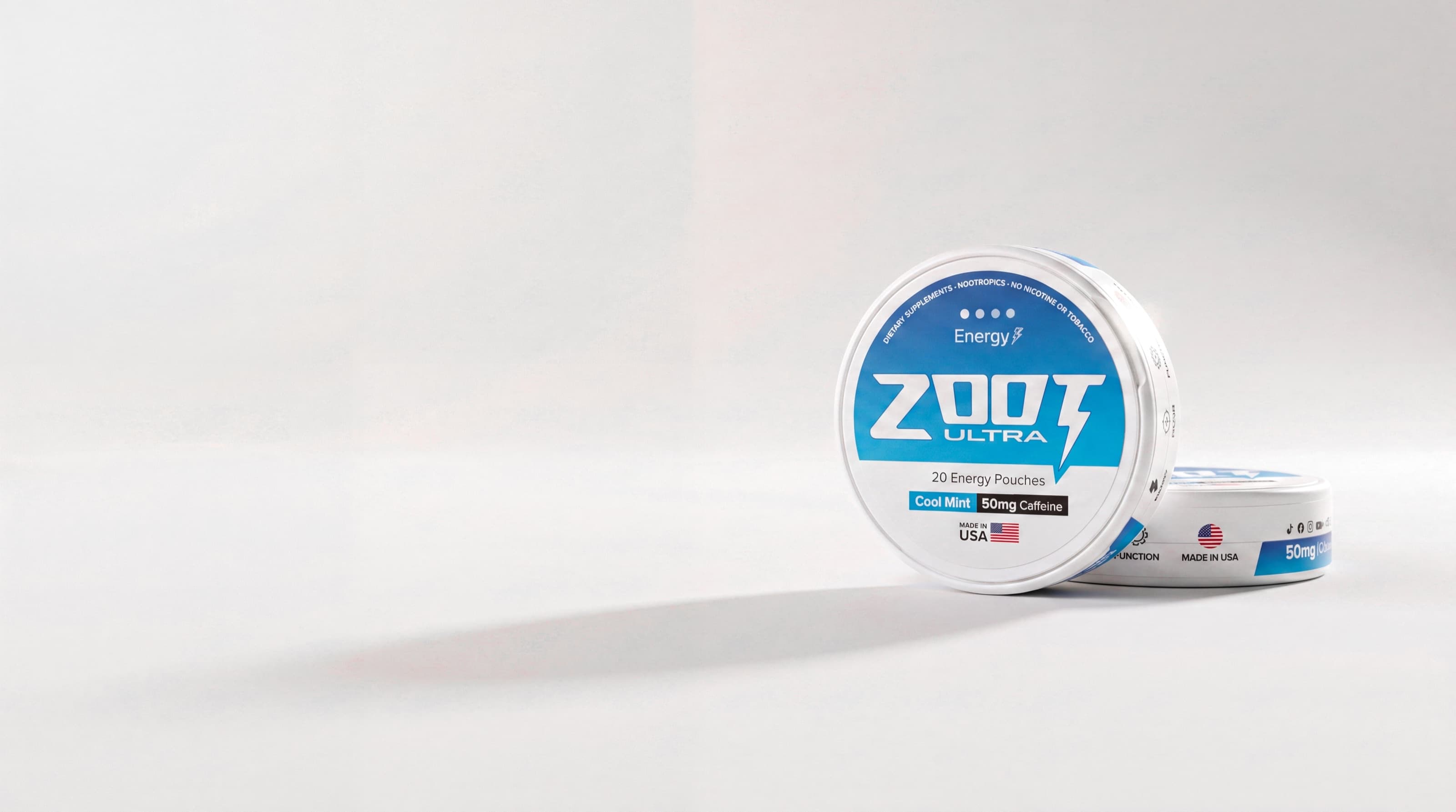 Two cans of Zoot Ultra Cool Mint on an off-white ground