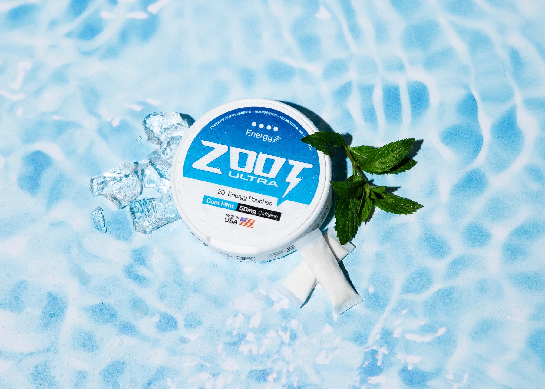Zoot Ultra Cool Mint can on pool water with crushed ice and fresh mint